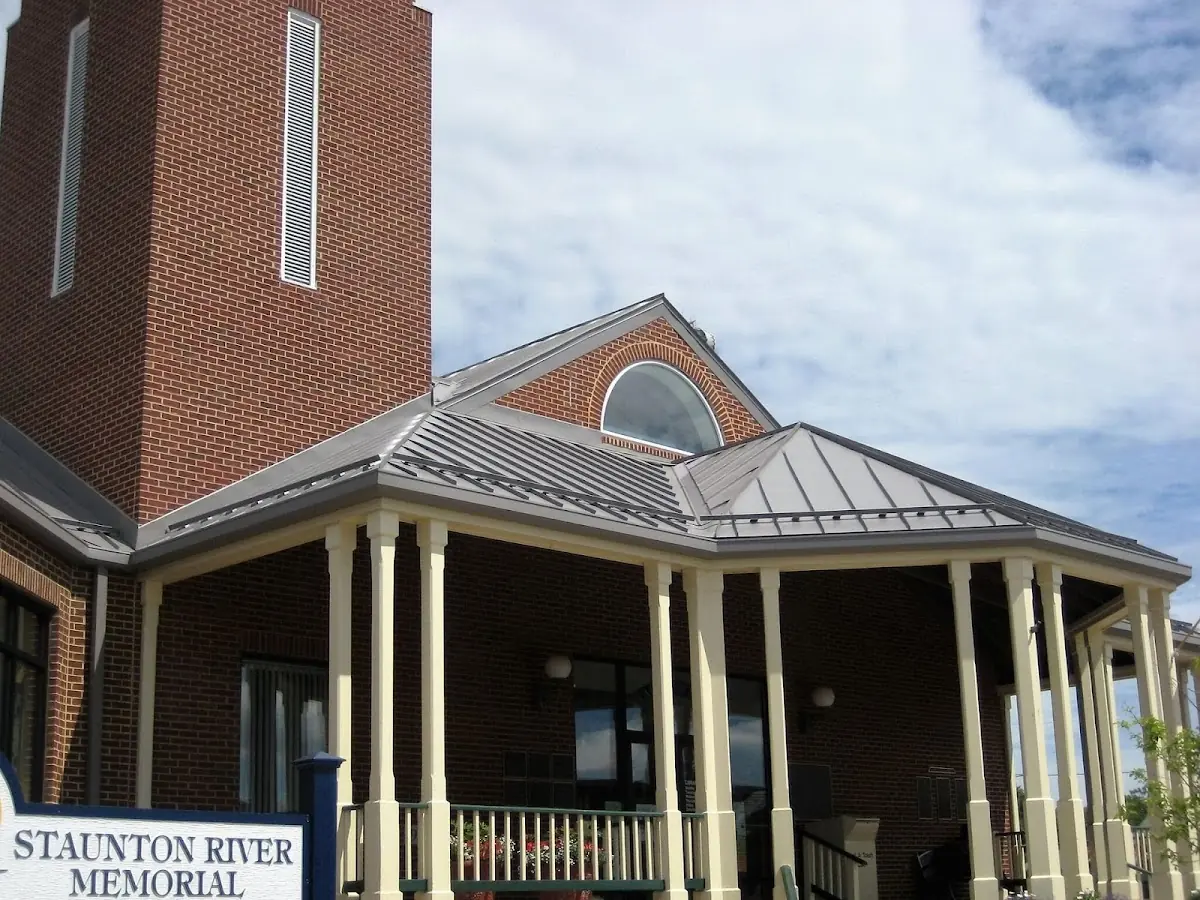 Skilled roofing craftsmen working on a residential roof in Houserville